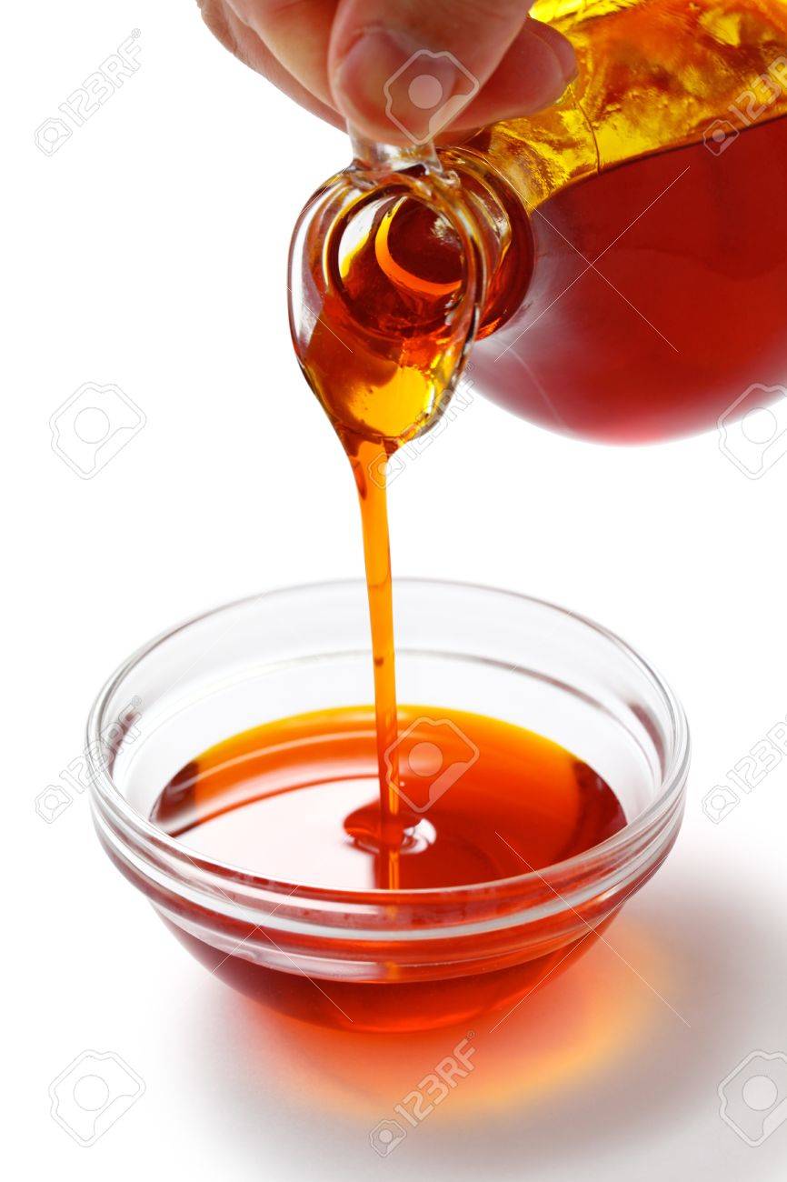 Pouring Red Palm Oil Into A Glass Bowl Stock Photo, Picture and Royalty  Free Image. Image 14960502., image size:866x1300