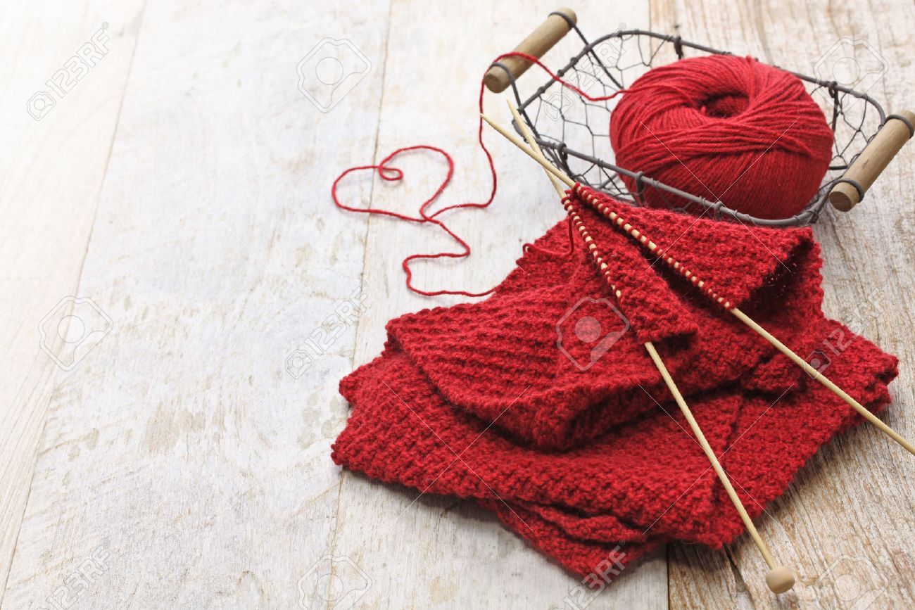 hand knitted red scarf and heart shaped thread - 55939796 hand knitted red scarf and heart shaped thread - 55939796