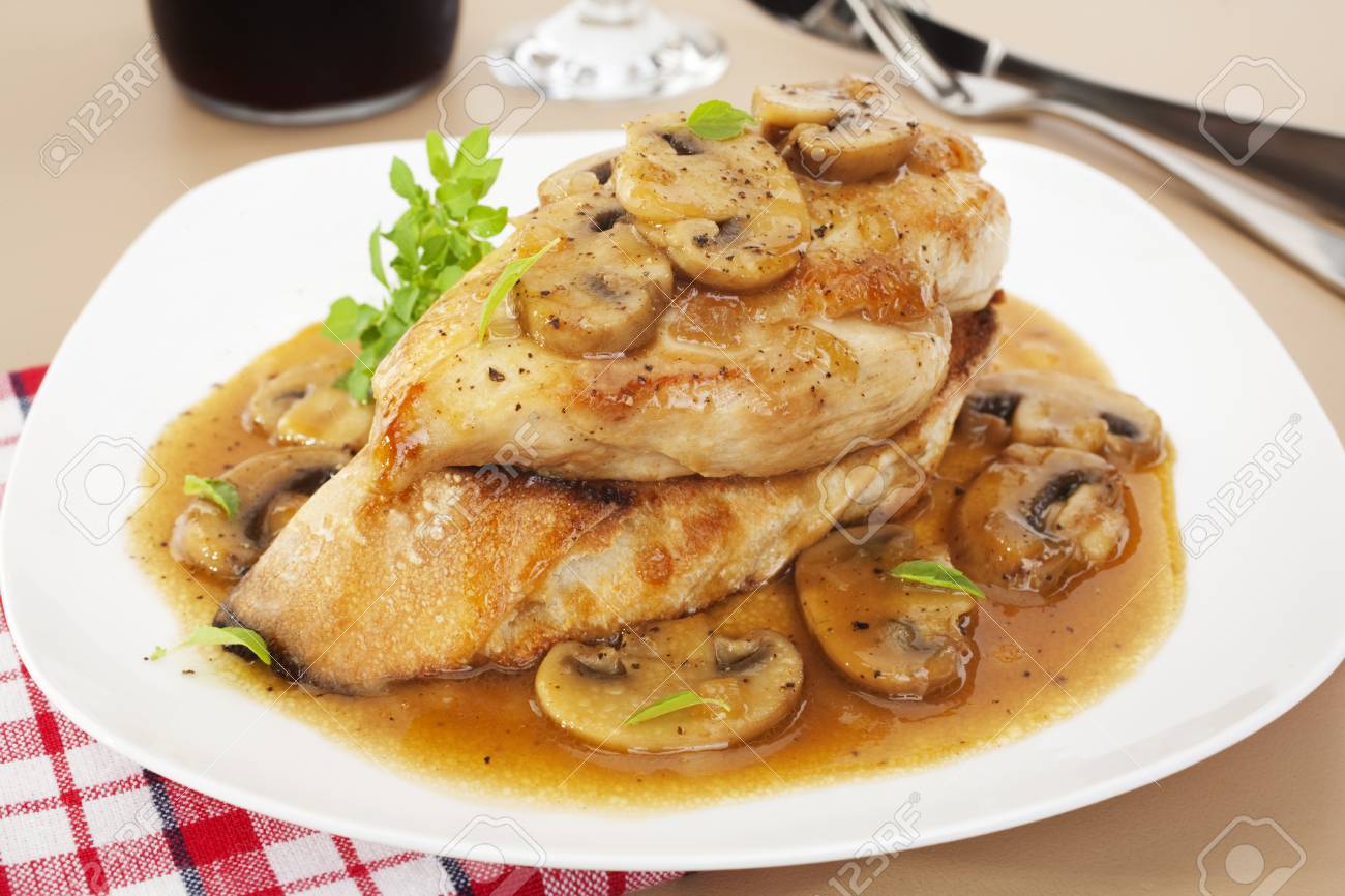 Chicken Marsala - popular Italian American dish, Marsala Chicken, served over toasted baguette. Chicken in a rich, sweet sauce with marsala, chicken stock and mushrooms. - 109456595 Chicken Marsala - popular Italian American dish, Marsala Chicken, served over toasted baguette. Chicken in a rich, sweet sauce with marsala, chicken stock and mushrooms. - 109456595