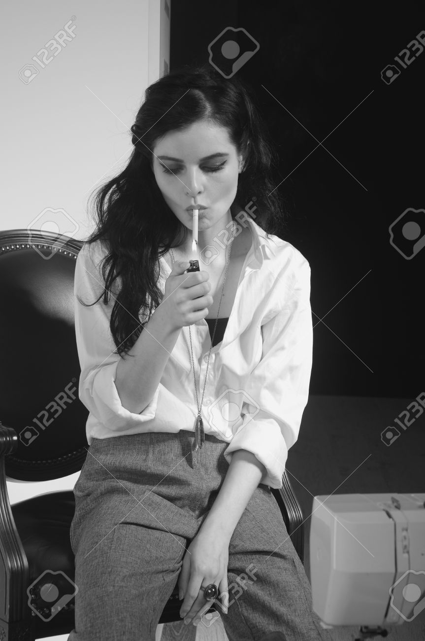 Girl smokes a cigarette at work black and white photography stock photo 60671741
