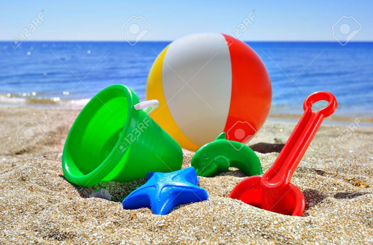 Children S Toys On The Beach Against The Blue Sea And Sky Stock Photo Picture and Royalty Free Image. Image 15152003