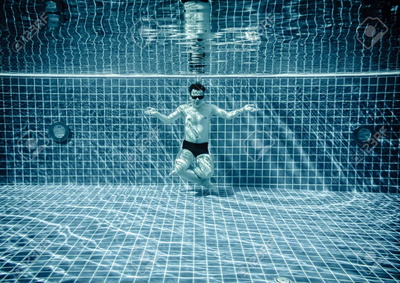 Man Sitting On The Bottom Of The Swimming Pool Under Water Stock Photo Picture And Royalty Free Image Image 29723300