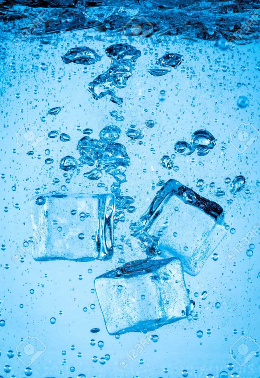 Ice Cubes Falling Into The Water Sinking To The Bottom Abstract Background Stock Photo Picture And Royalty Free Image Image