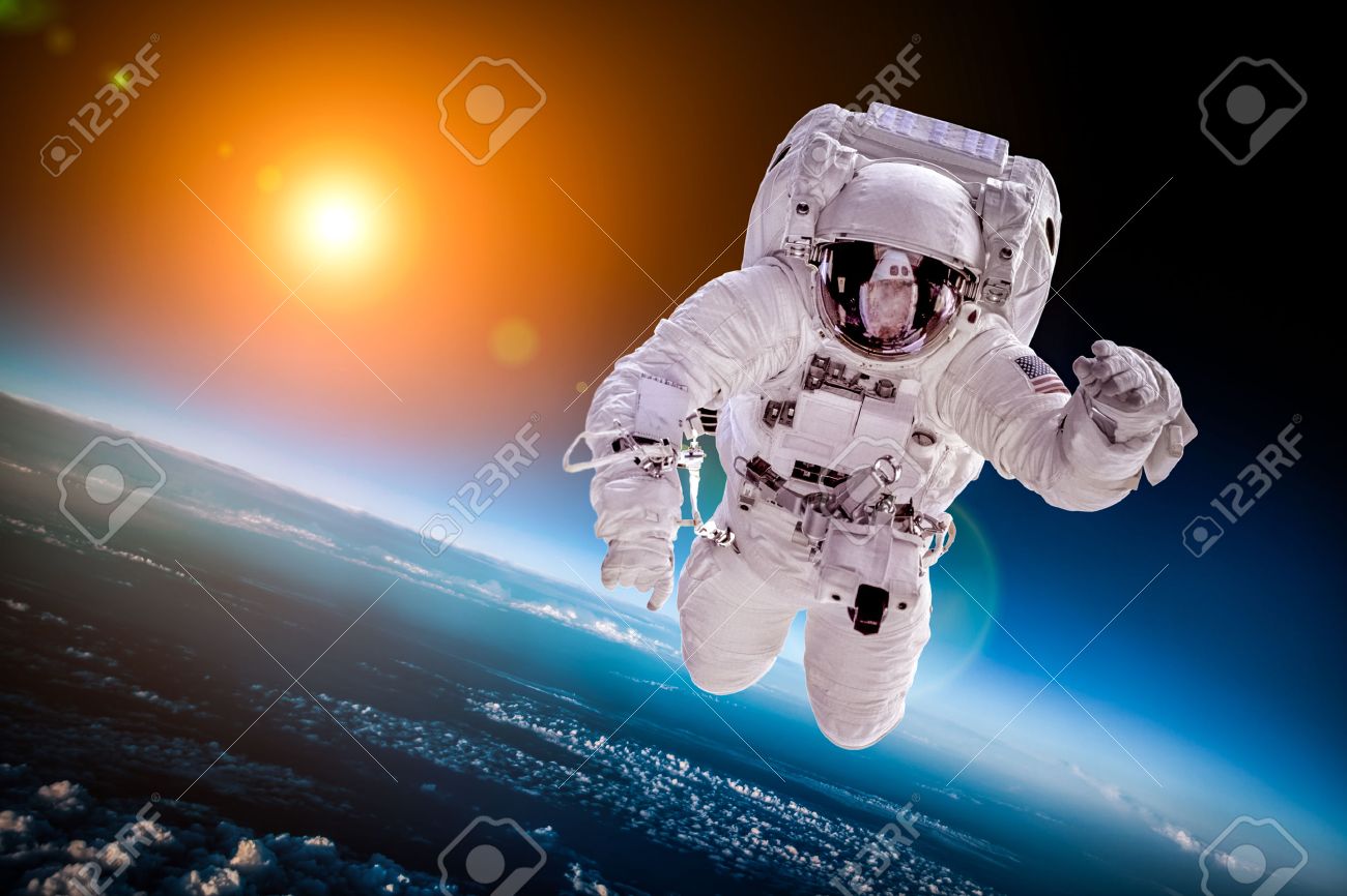 Astronaut in outer space against the backdrop of the planet earth - 43960884 Astronaut in outer space against the backdrop of the planet earth - 43960884