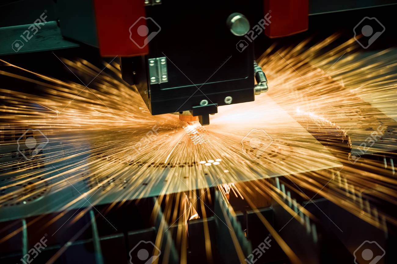 CNC Laser cutting of metal, modern industrial technology. Small depth of field. Warning - authentic shooting in challenging conditions. - 120245403 CNC Laser cutting of metal, modern industrial technology. Small depth of field. Warning - authentic shooting in challenging conditions. - 120245403