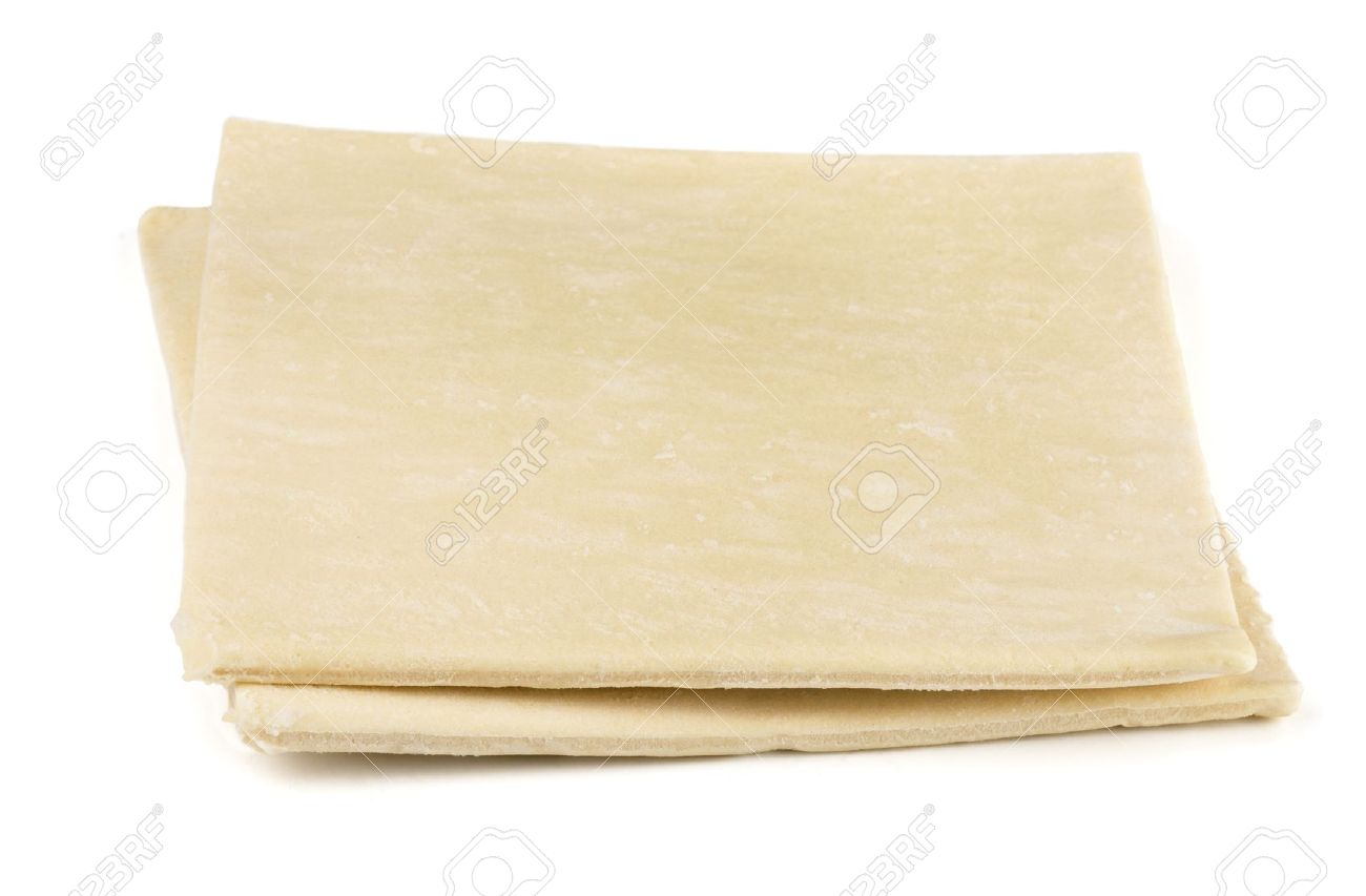 two sheets of frozen puff pastry isolated on white stock photo frozen puff pastry sheets