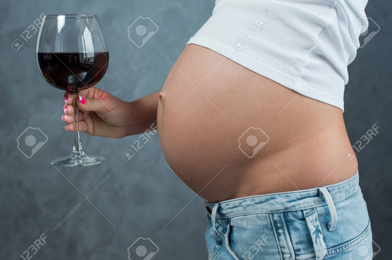 Close Up Of A Cute Pregnant Belly And Glass Of Wine Alcohol Stock Photo Picture And Royalty Free Image Image 47934412
