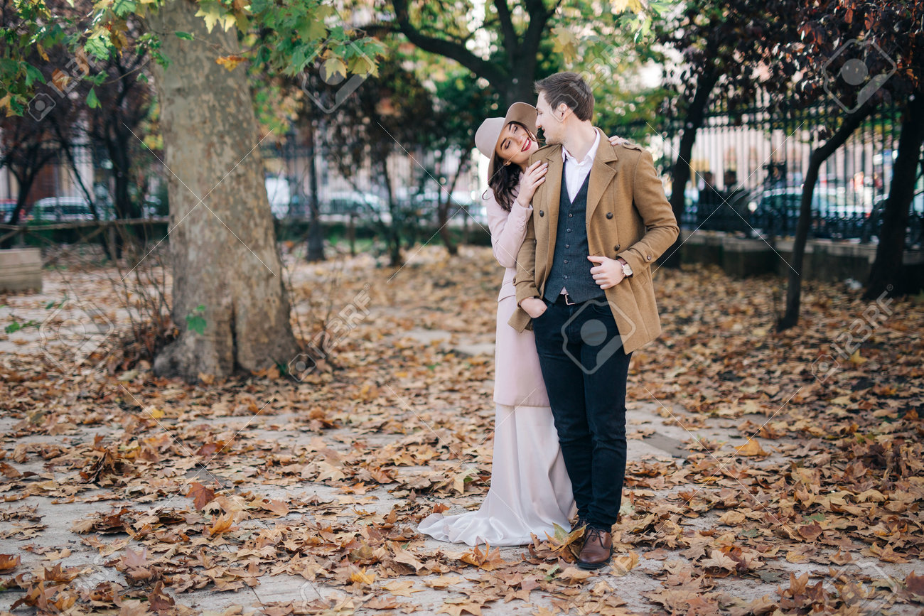 Young elegant fashion couple in park - 76151537 Young elegant fashion couple in park - 76151537