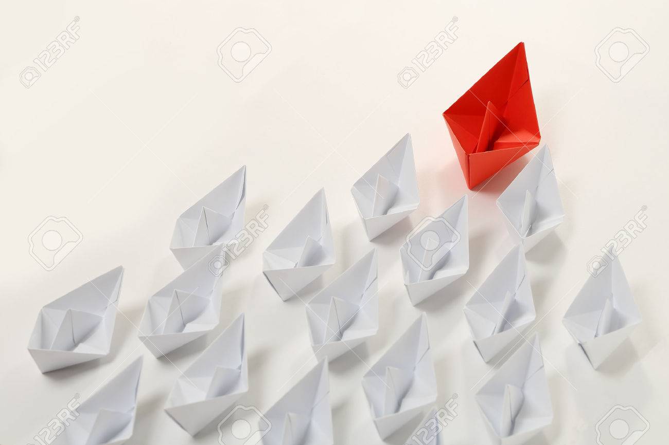 red paper boat leading white ones, leadership concept - 46102630 red paper boat leading white ones, leadership concept - 46102630