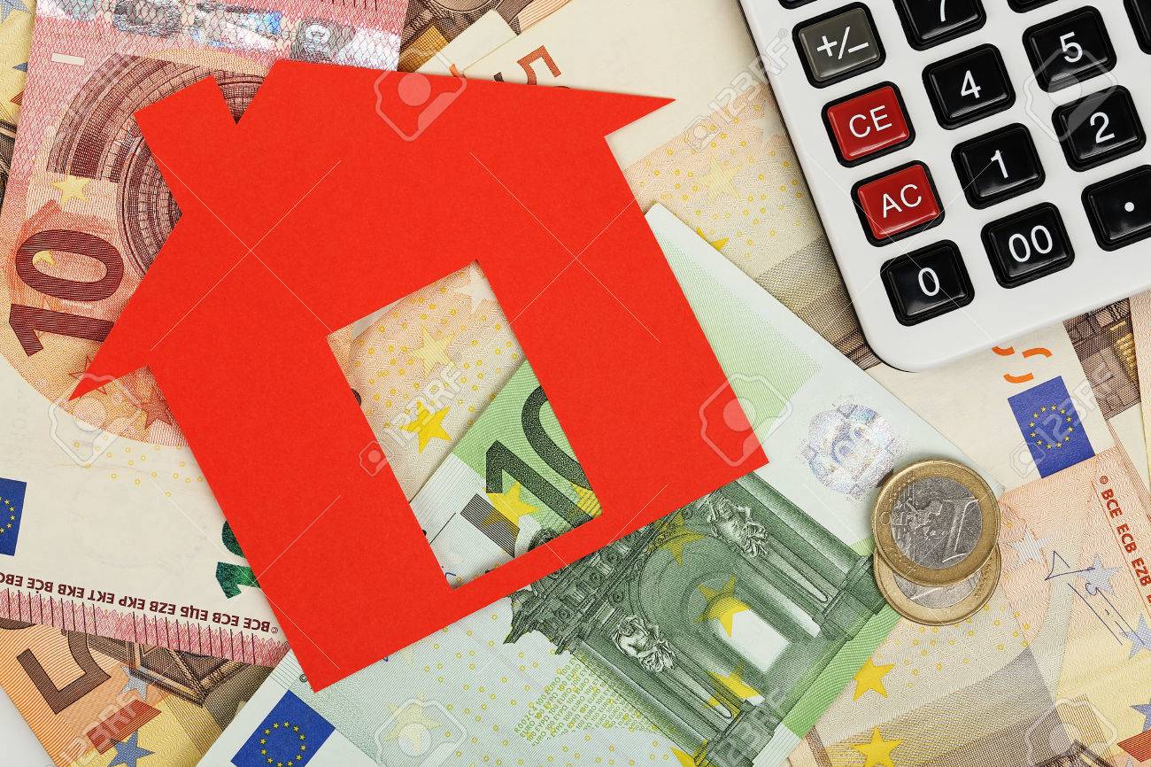 red paper house with euro banknotes and calculator - 48929855 red paper house with euro banknotes and calculator - 48929855