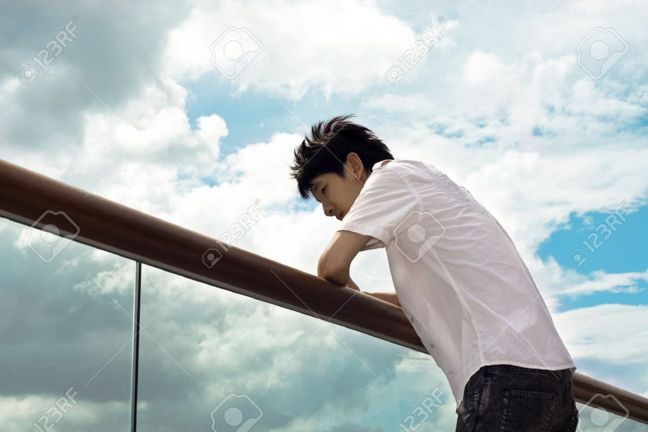 Sad Boy Hand On The Handrail And Sky Background Stock Photo ...