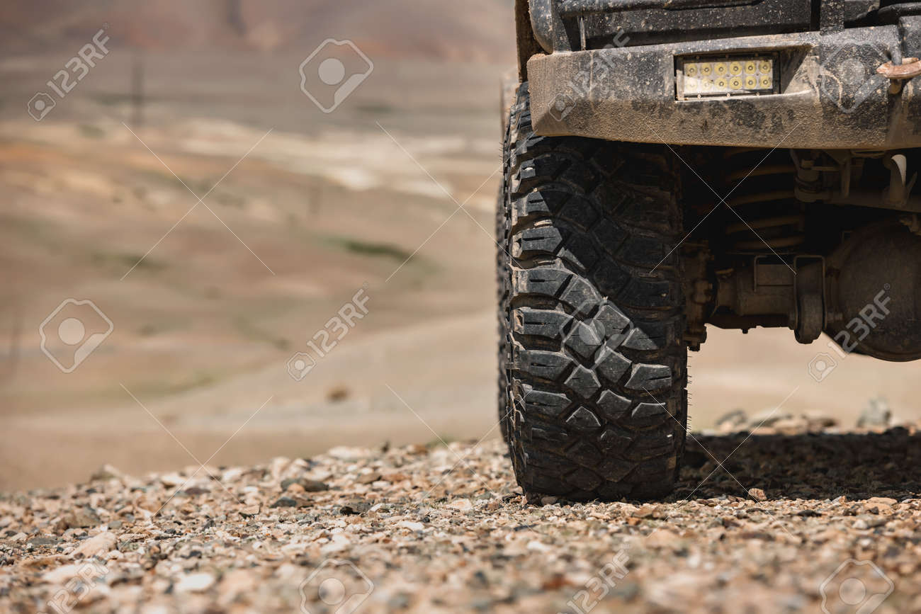 Close up photo of offroad car wheel - 165803296 Close up photo of offroad car wheel - 165803296