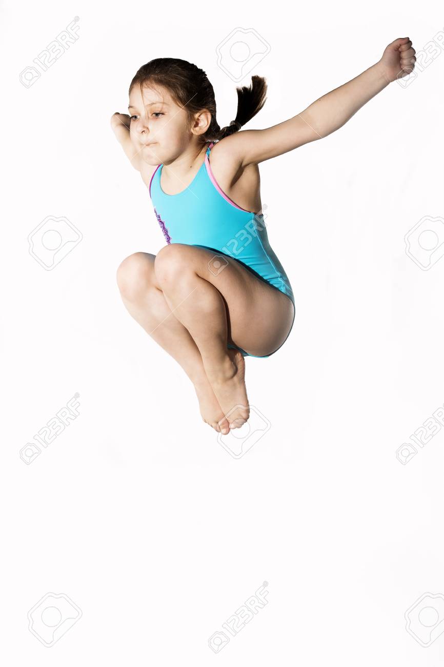 Little caucasian female 7 years old girl in cyan swimming costume