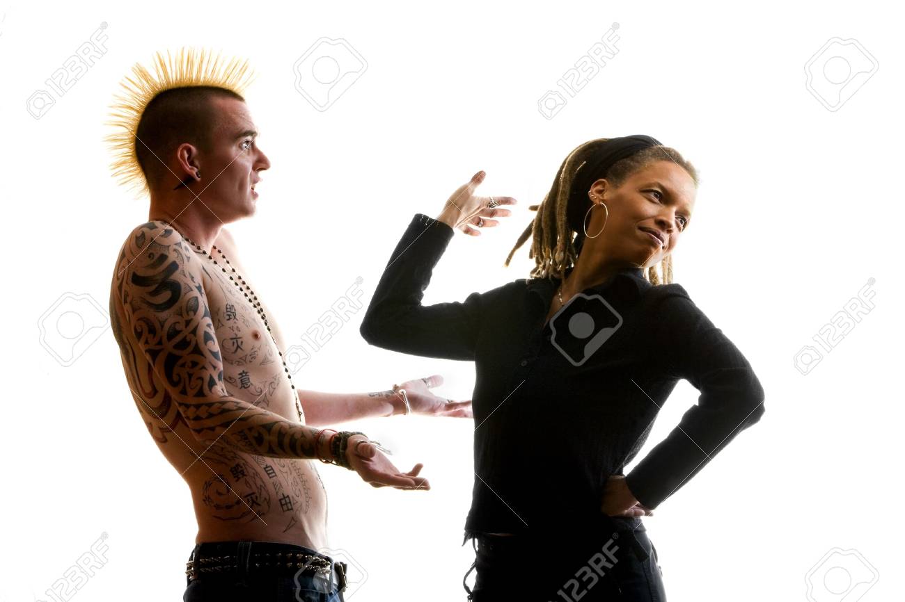 Man With Mohawk And Woman Wearing Dreadlocks