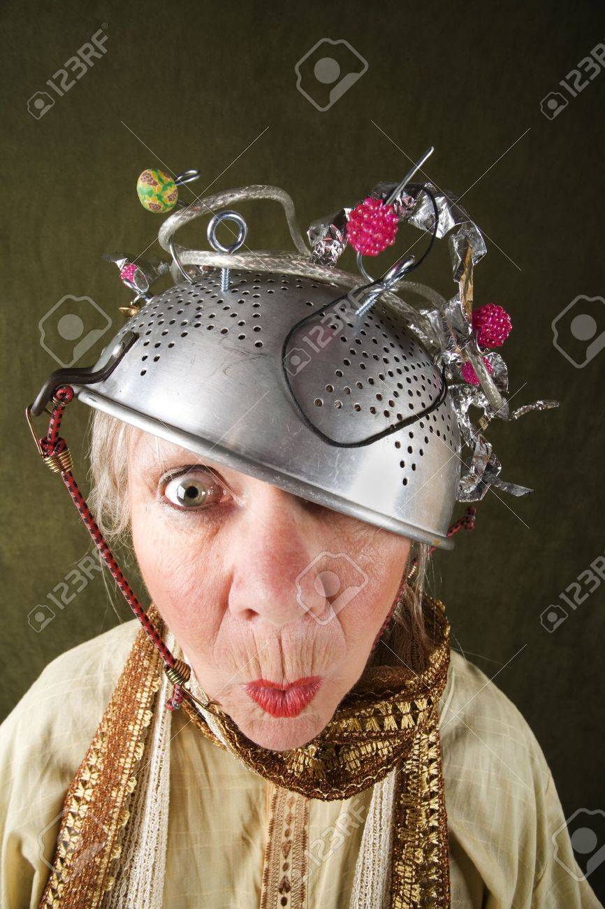 Crazy woman wearing a metal colander for a helmet - 4618596 Crazy woman wearing a metal colander for a helmet - 4618596