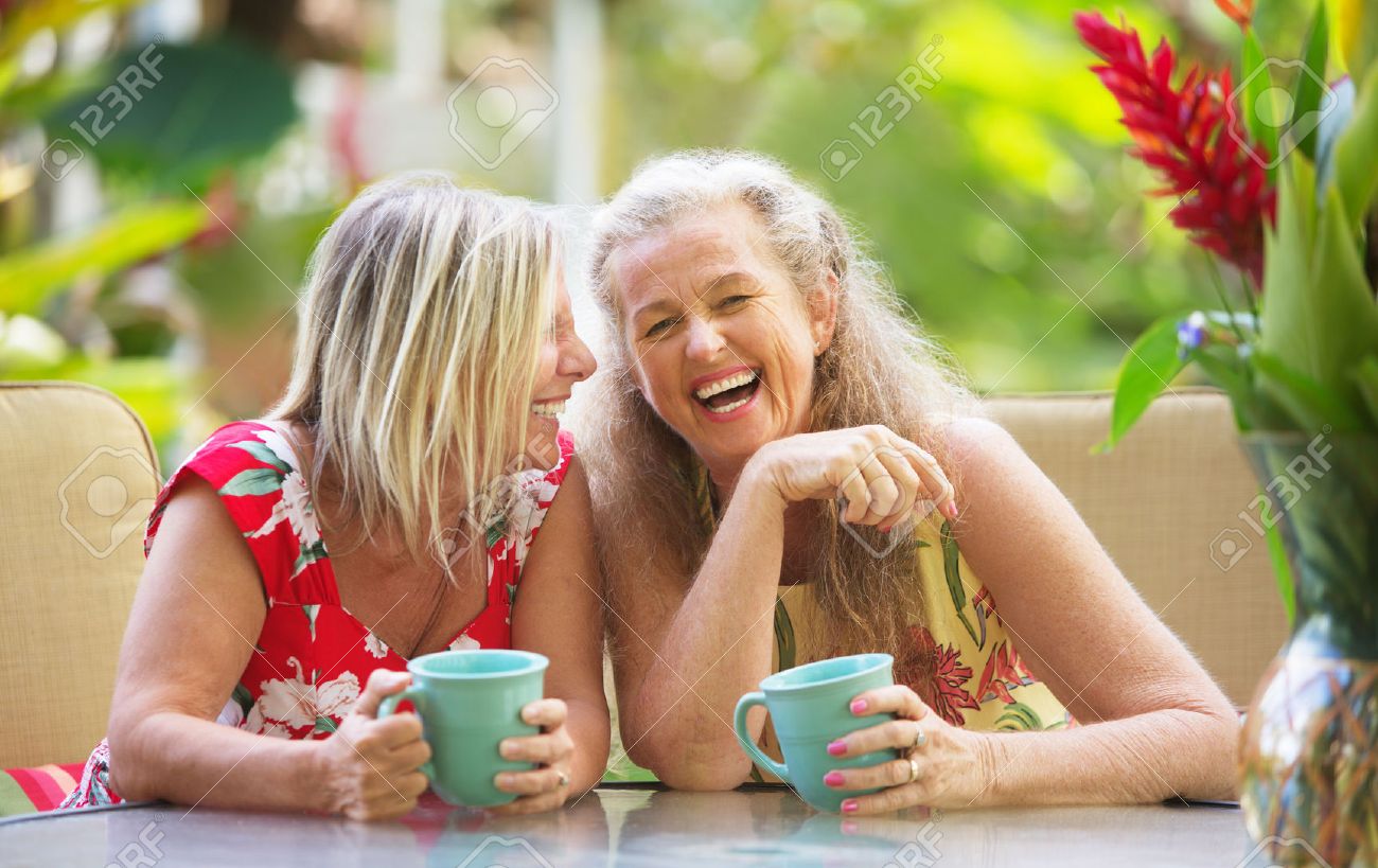 Pair of cute middle aged female friends laughing - 42781245 Pair of cute middle aged female friends laughing - 42781245