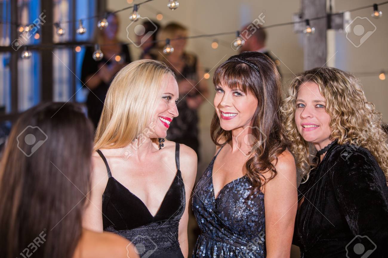 Scott Griessel / CreatistaThree Beautiful Mature Women At A Party picture