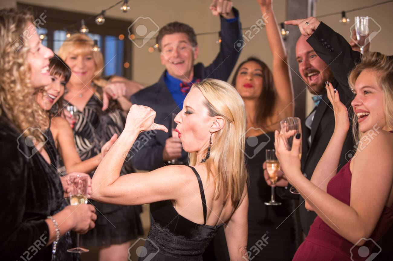 Scott Griessel / CreatistaFunny Mature Woman Strutting At A Party image