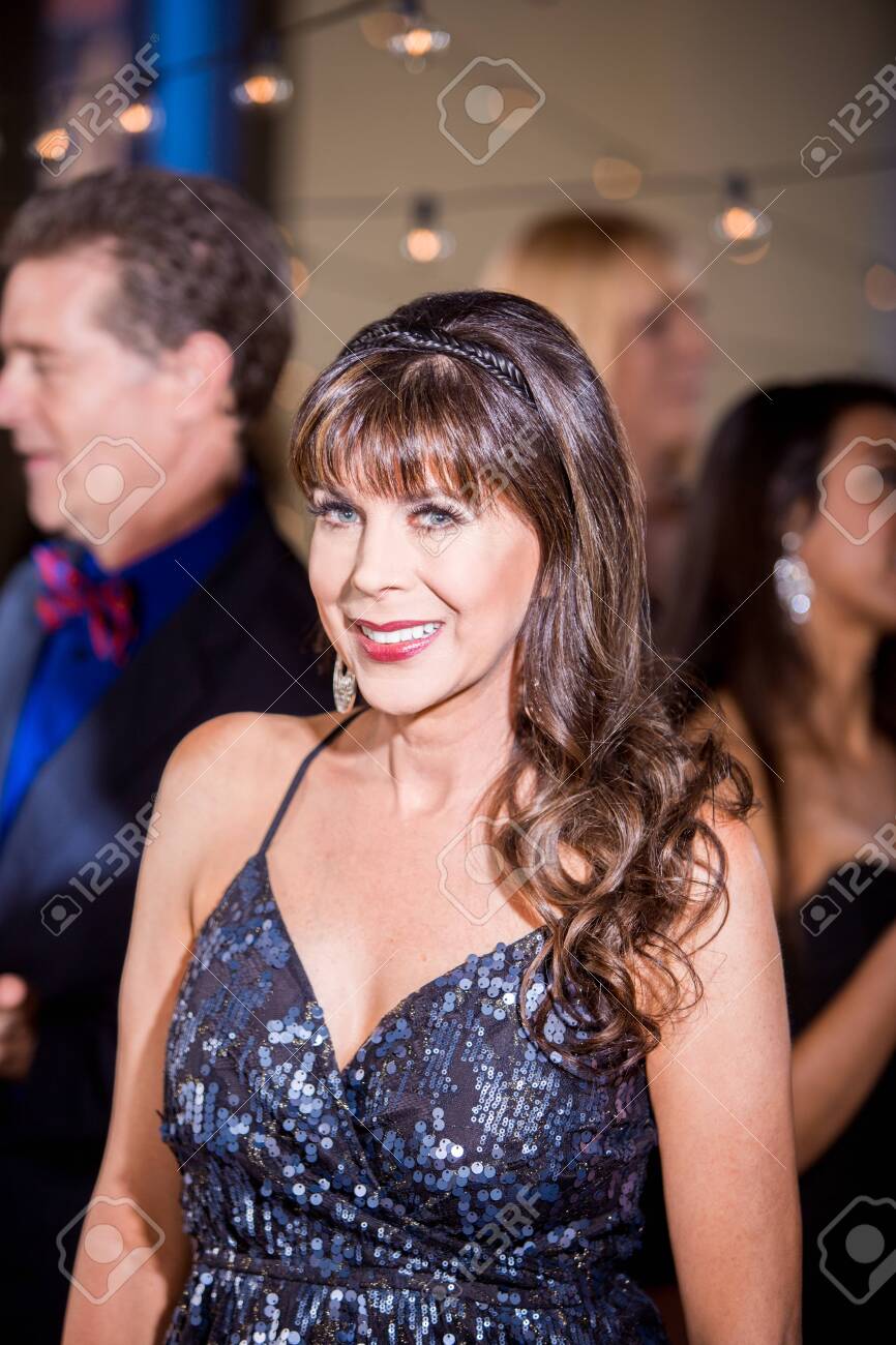 Scott Griessel / CreatistaPretty Mature Woman At A Party Stock