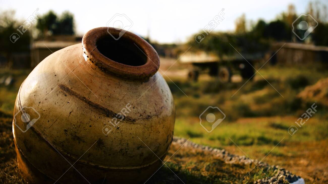Clay Water Jug. Clay Jug Handmade Isolated. Traditional Pitcher. Old  Ceramic Pot Stock Photo, Picture And Royalty Free Image. Image 147758202.