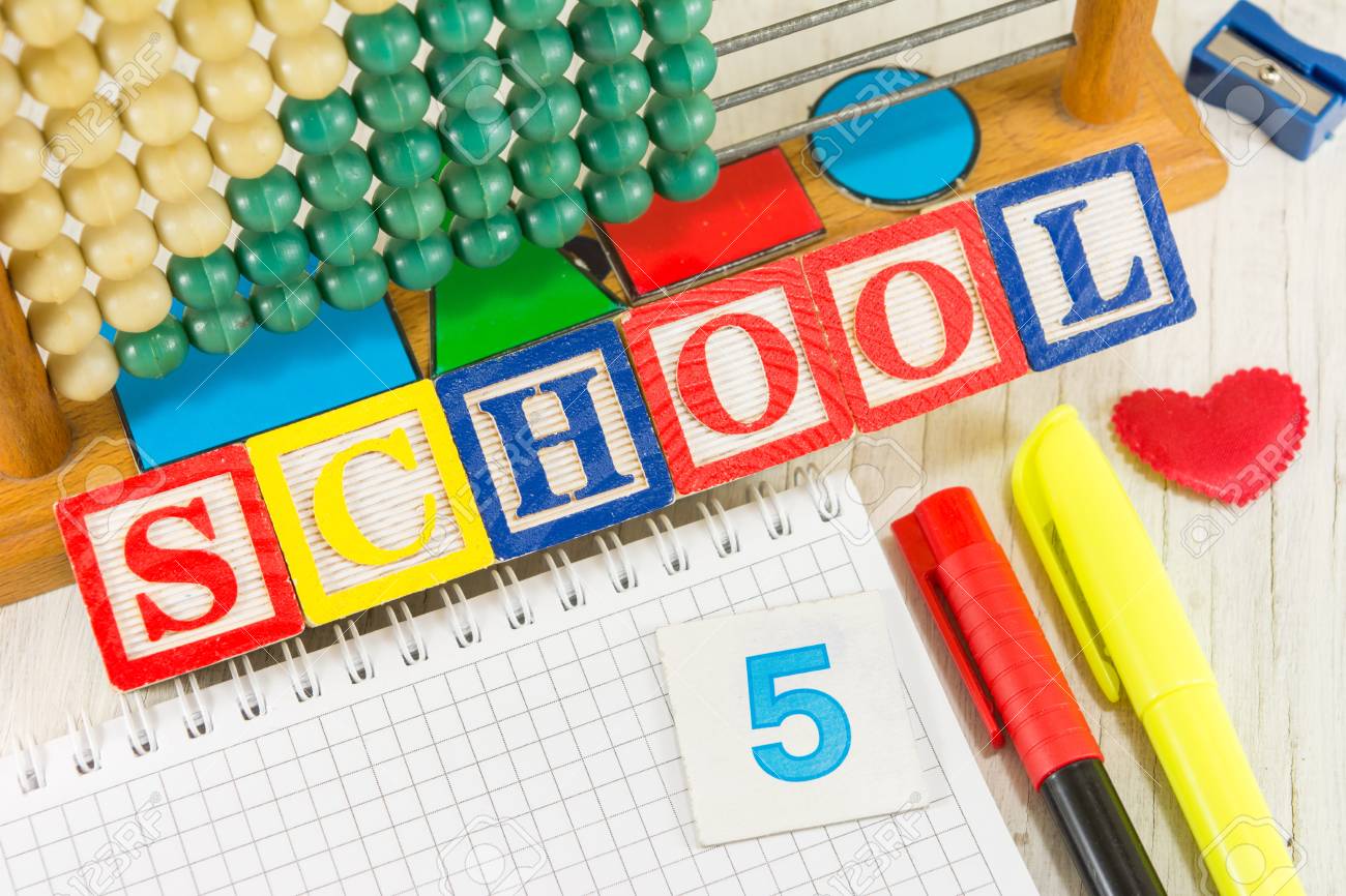 Word SCHOOL Written With Wooden Cubicle Letters And Learning Stock