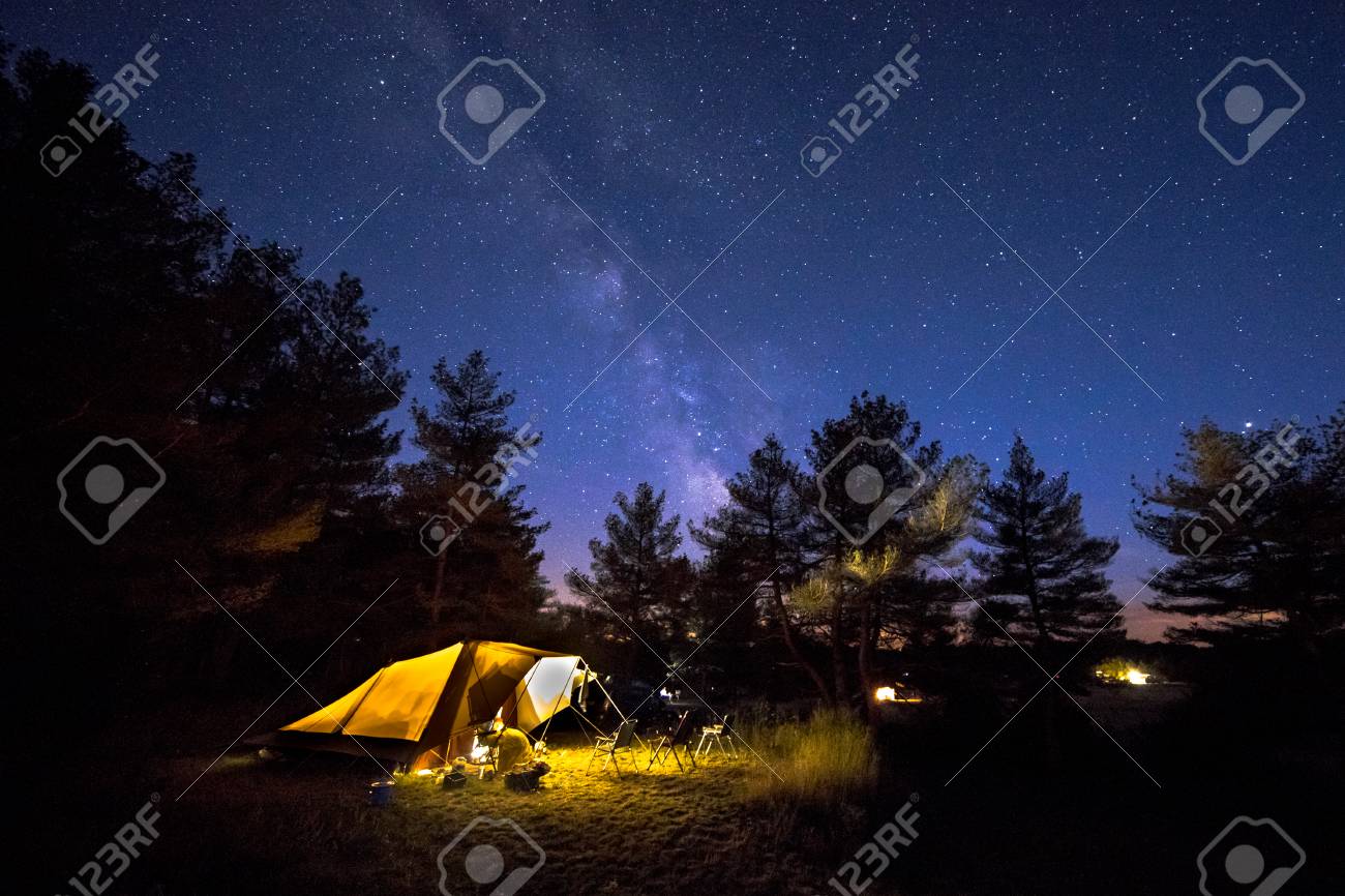Family tent with rigid steel poles on camping ground under Starry sky with Milky Way - 115935649 Family tent with rigid steel poles on camping ground under Starry sky with Milky Way - 115935649