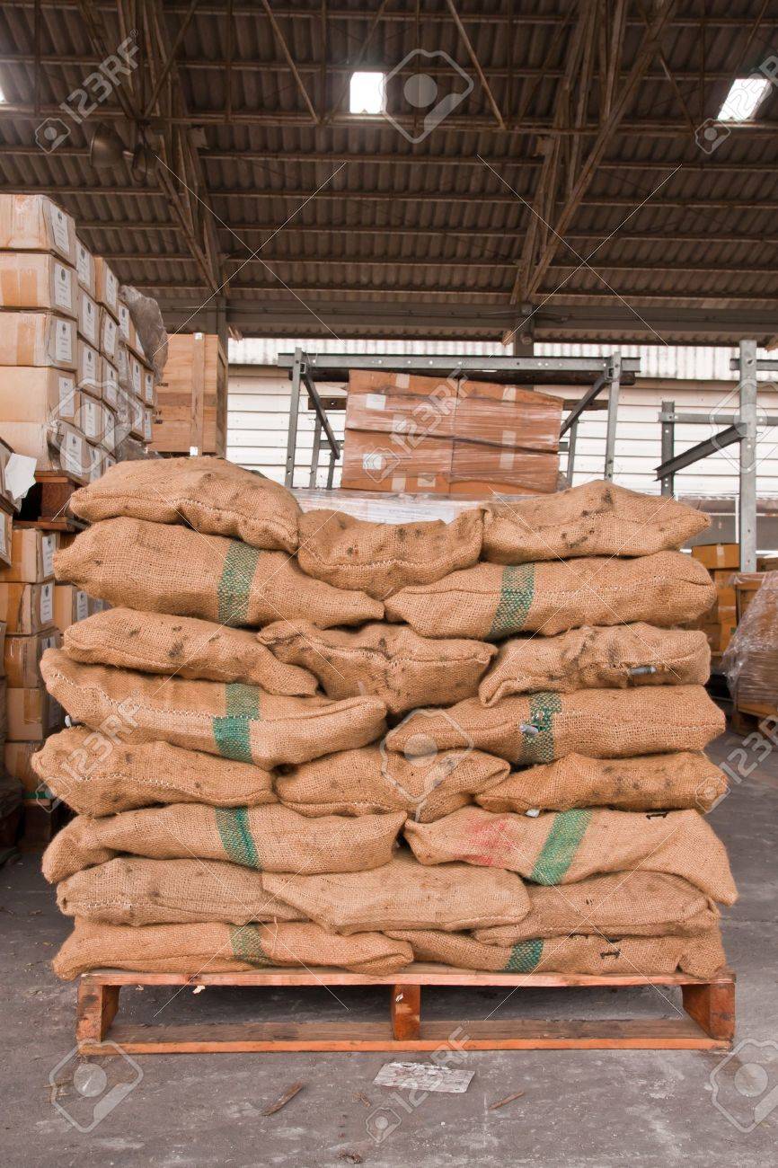 Brown sacks stack on wooden pallet in stockpile - 10463271 Brown sacks stack on wooden pallet in stockpile - 10463271