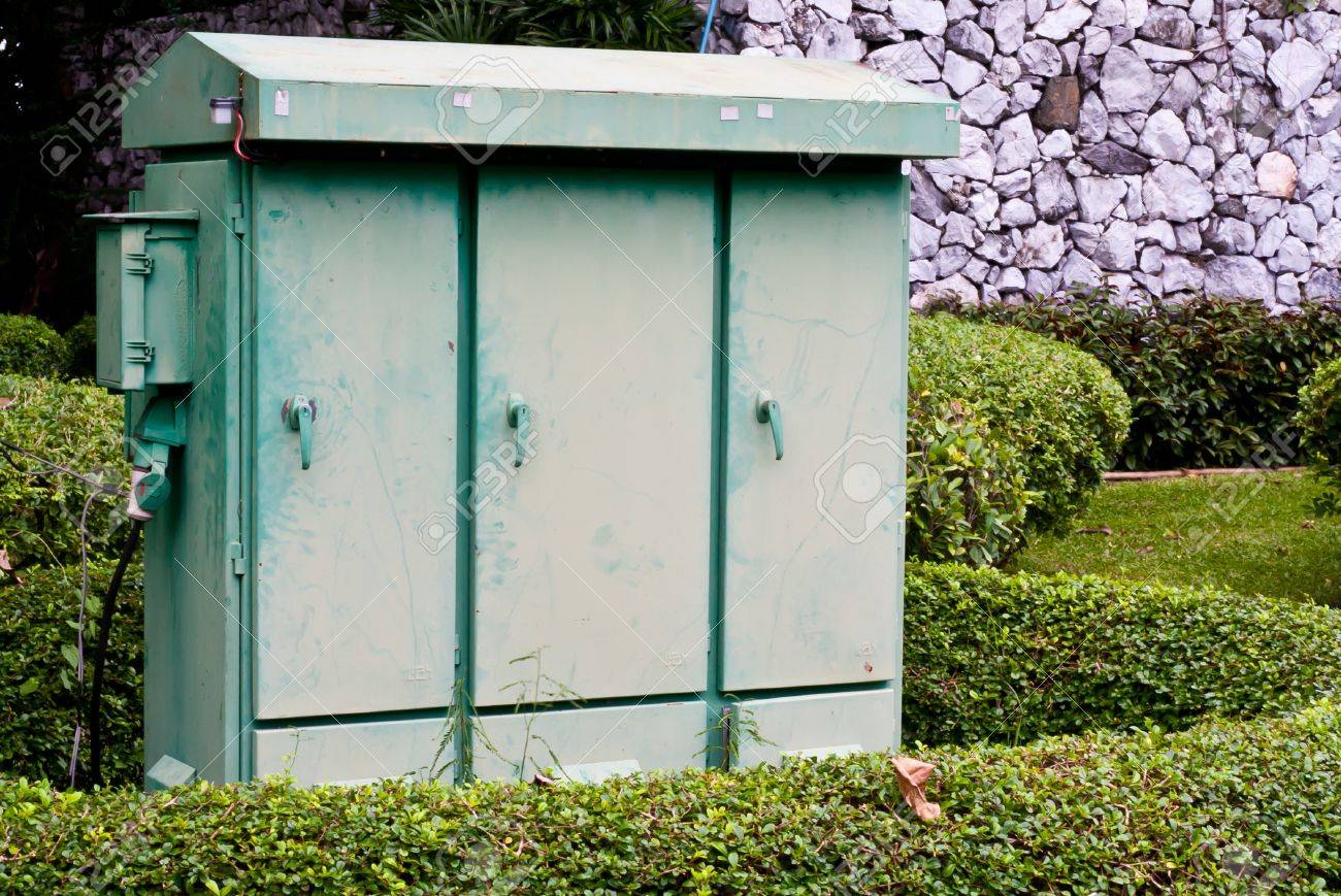 Metal electric substation cabinet in green park - 12353978 Metal electric substation cabinet in green park - 12353978