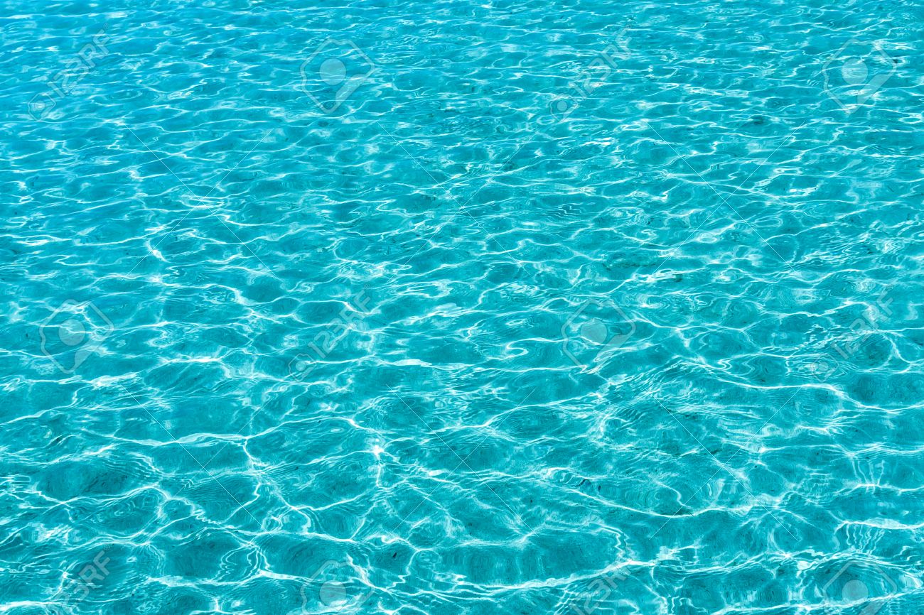 turquoise sea water surface seamless background texture stock photo