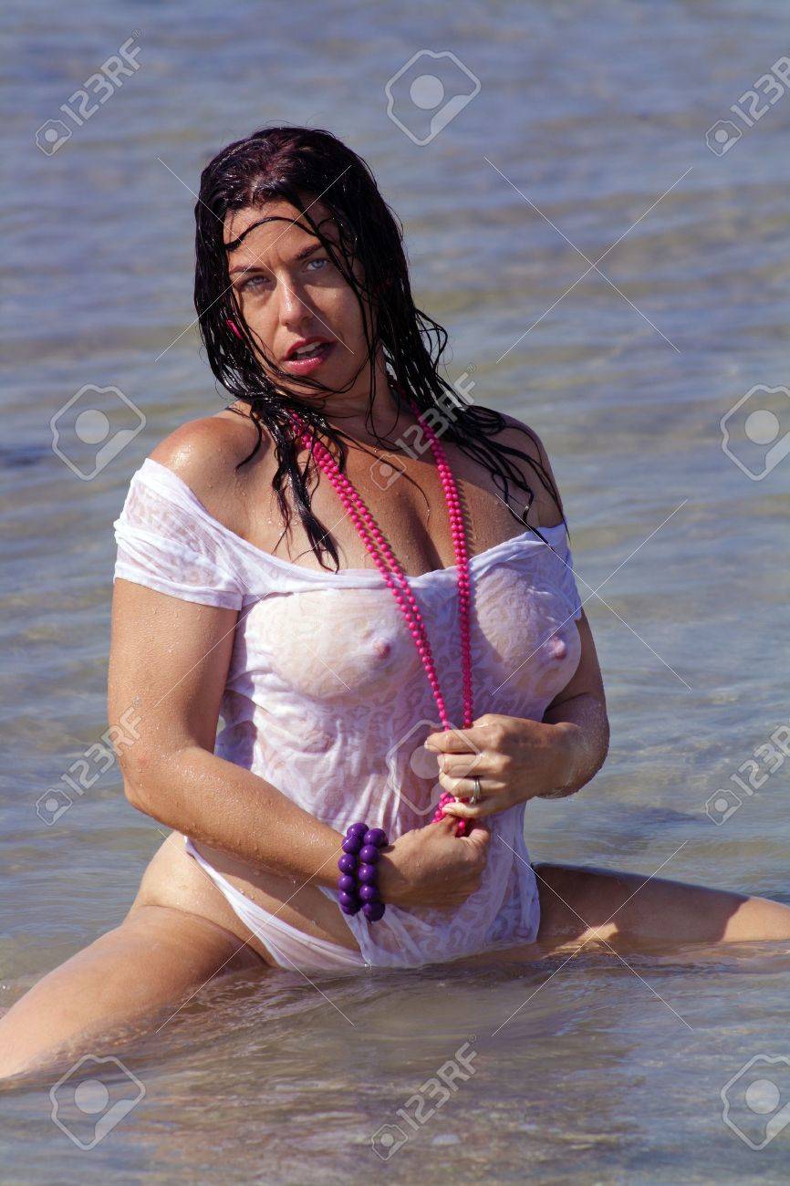 Nude woman relaxing on beach photo 928