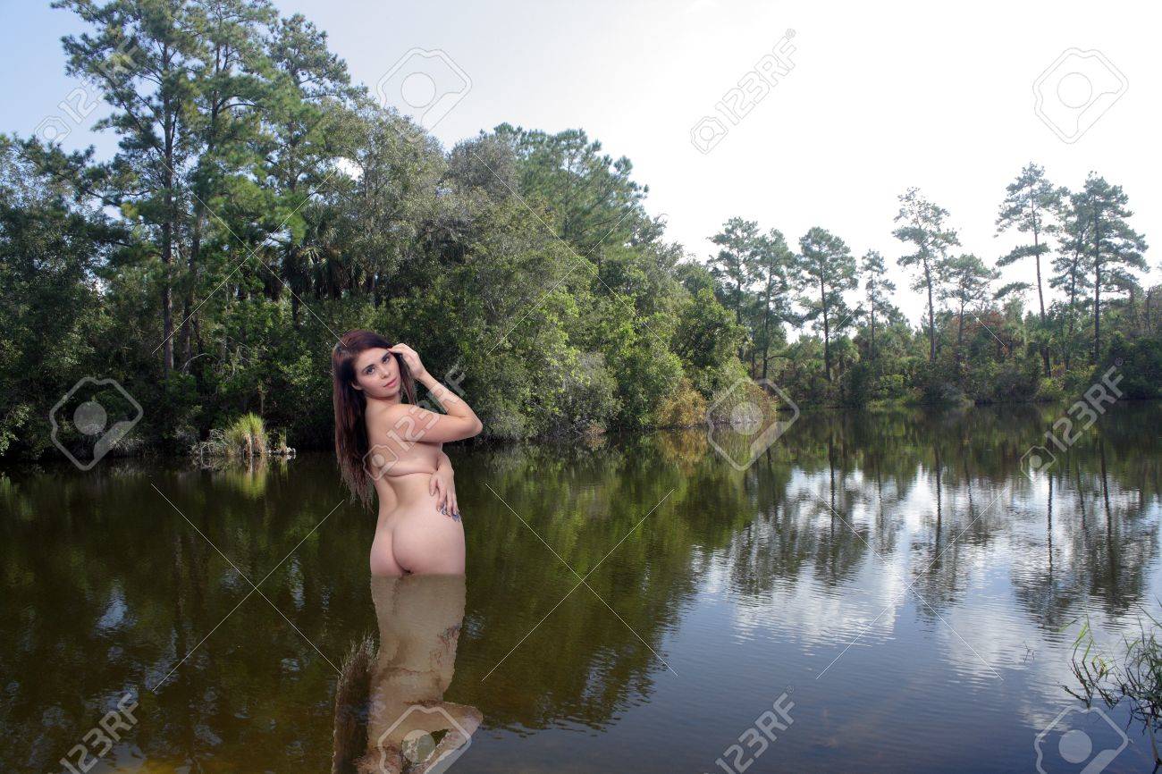 Nude Female Wading In A Lake Stock Photo, Picture And Royalty Free Image