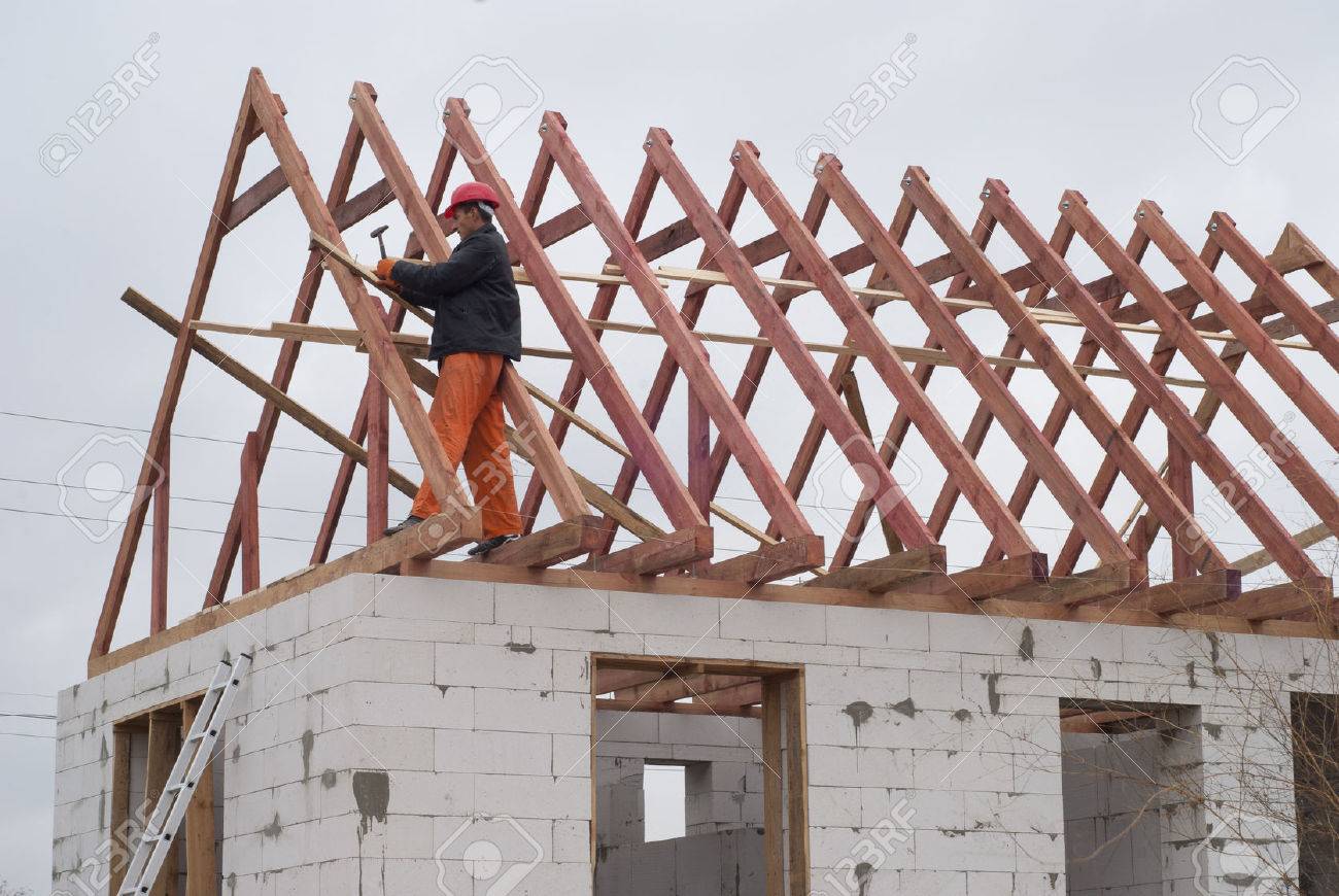 builder is installing roof system on the house of aerated concrete - 46806238 builder is installing roof system on the house of aerated concrete - 46806238