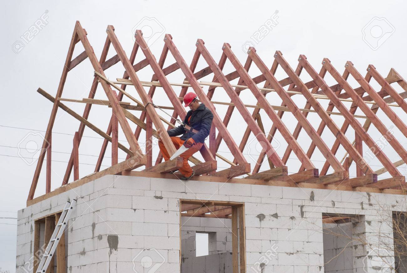 builder is installing roof system on the house of aerated concrete - 46806246 builder is installing roof system on the house of aerated concrete - 46806246