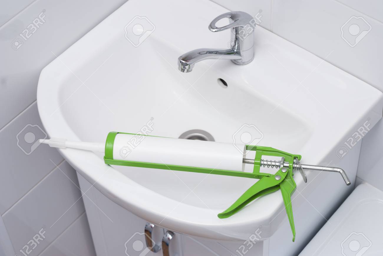 Sanitary Silicone Sealant Against The Background Of A Sink In
