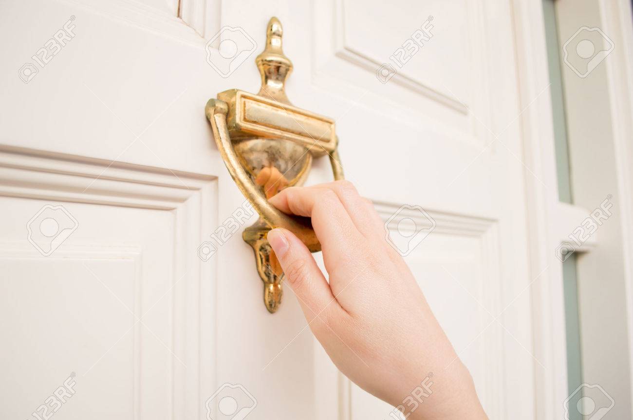 Woman Holding At The Door Using The Old Knock Door Stock Photo - 1300x864 - jpeg Knocking On The Door
