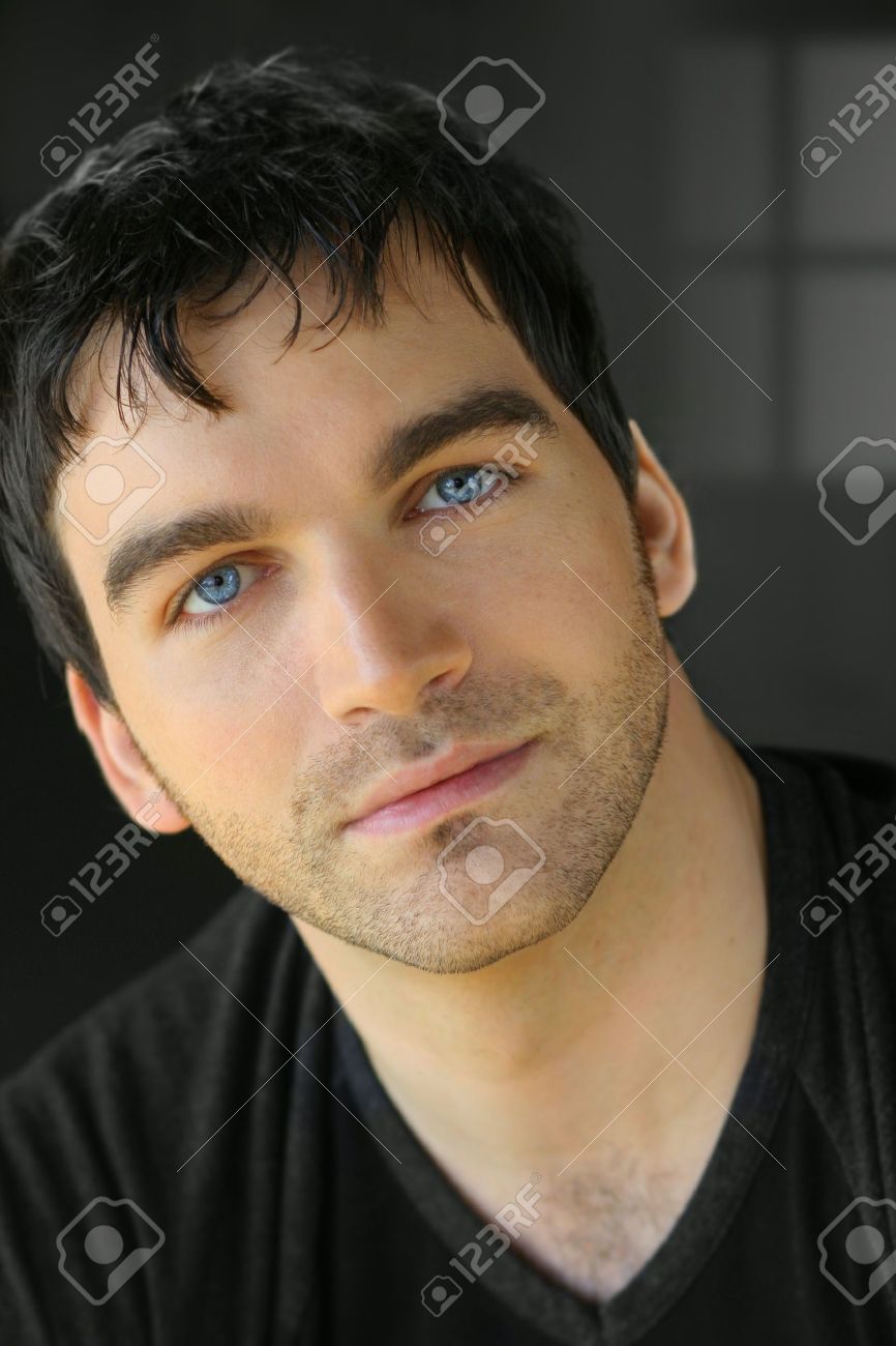 Portrait Of A Nice Young Attractive Man With Blue Eyes Stock Photo