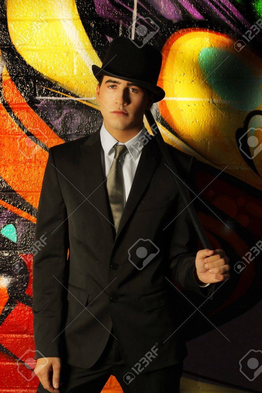 orange top hat and cane