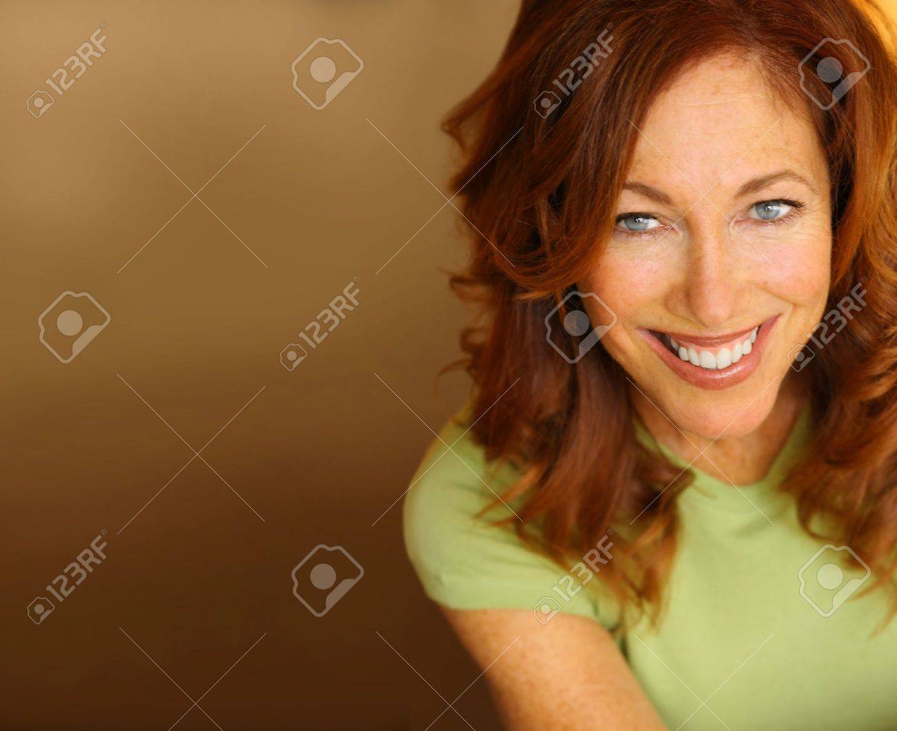 Portrait of a beautiful woman with big smile against neutral background - 10854670 Portrait of a beautiful woman with big smile against neutral background - 10854670