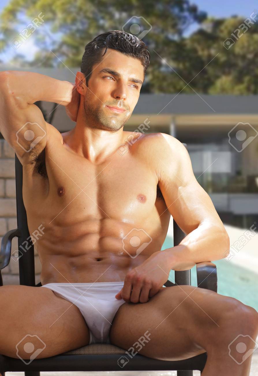 Outdoor Summer Portrait Of Sexy Male Model Relaxing In Underwear With Legs  Spread And Arms Up Near Pool Stock Photo, Picture and Royalty Free Image.  Image 20047791.
