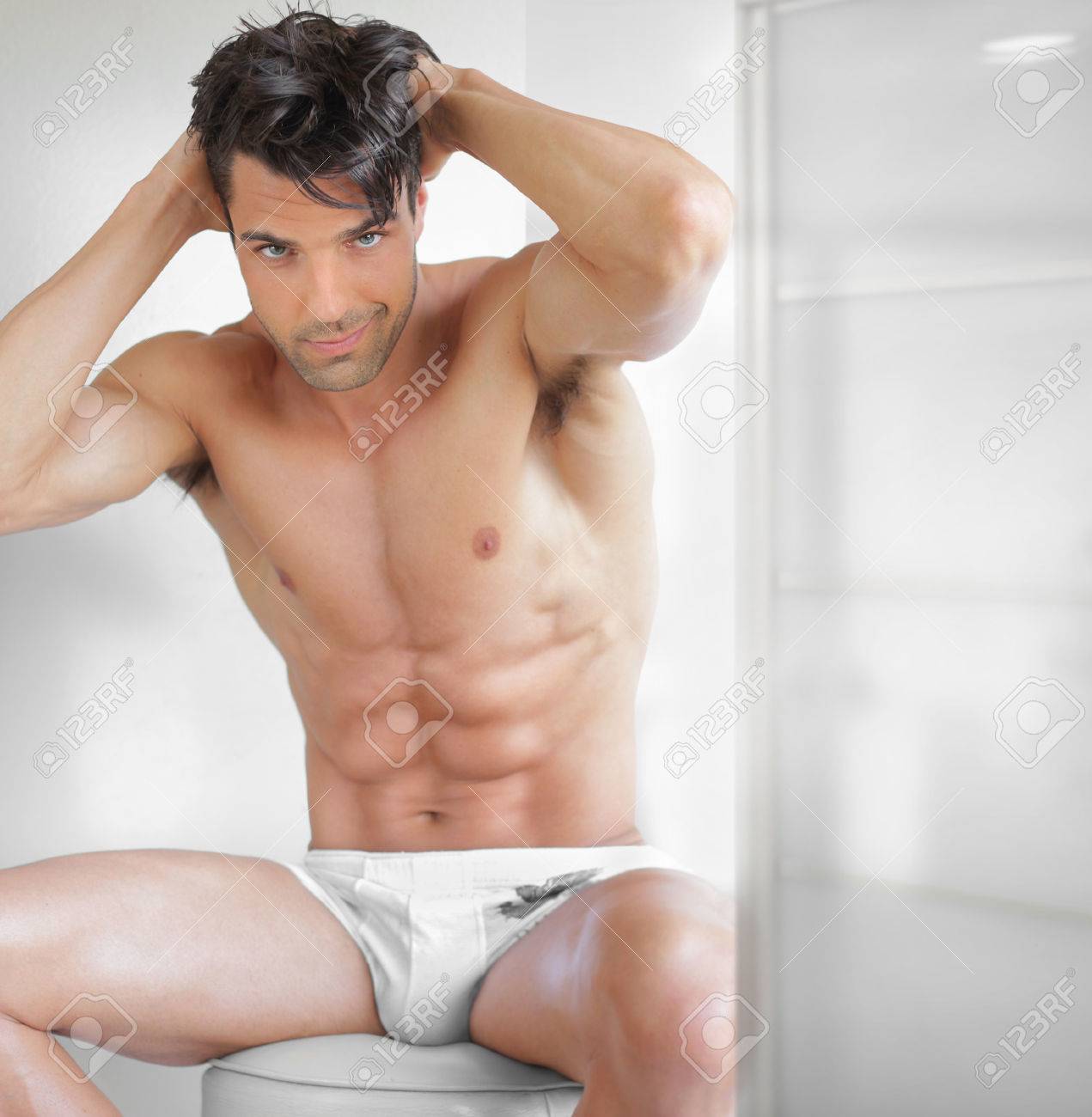 25028681-Portrait-of-a-fit-sexy-male-model-in-underwear-in-modern-setting-Stock-Photo.jpg