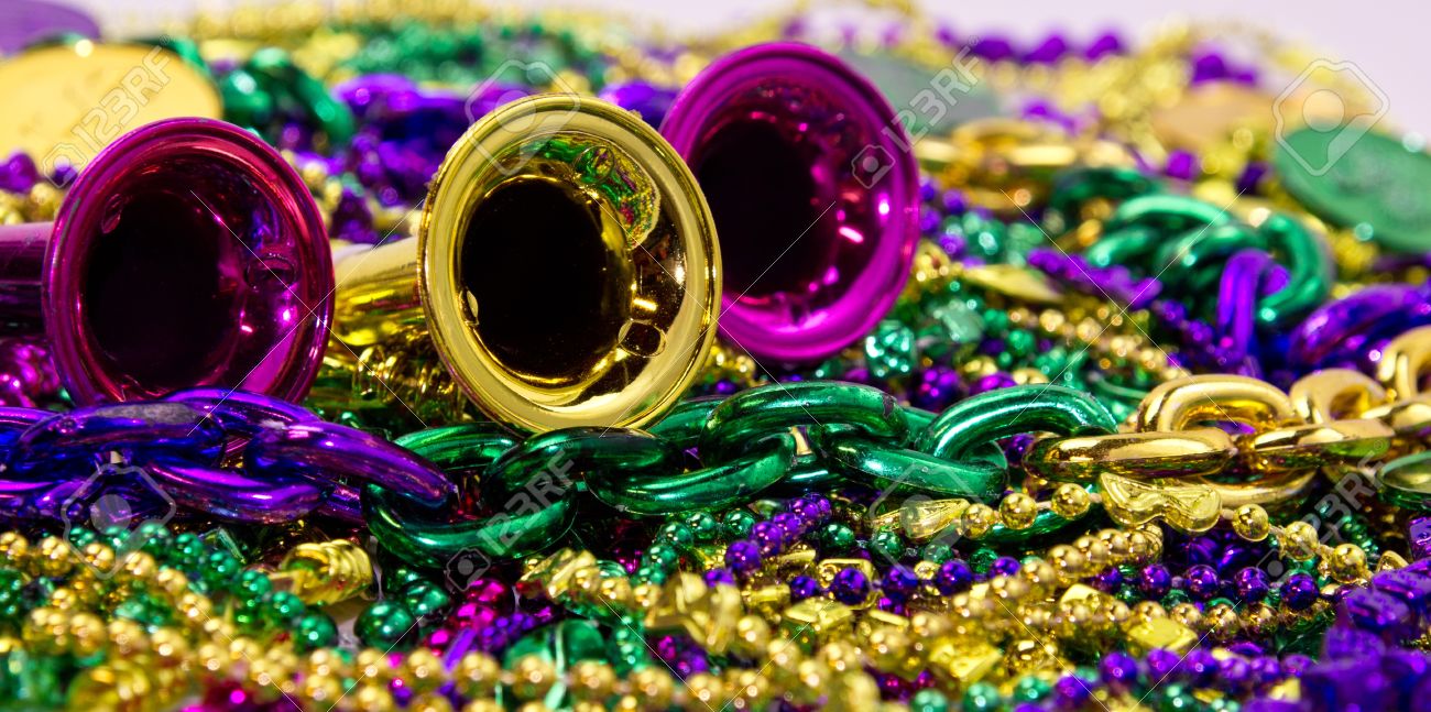 Celebration Horns On A Background Of Colorful Mardi Gras Beads Stock Photo Picture And Royalty Free Image Image