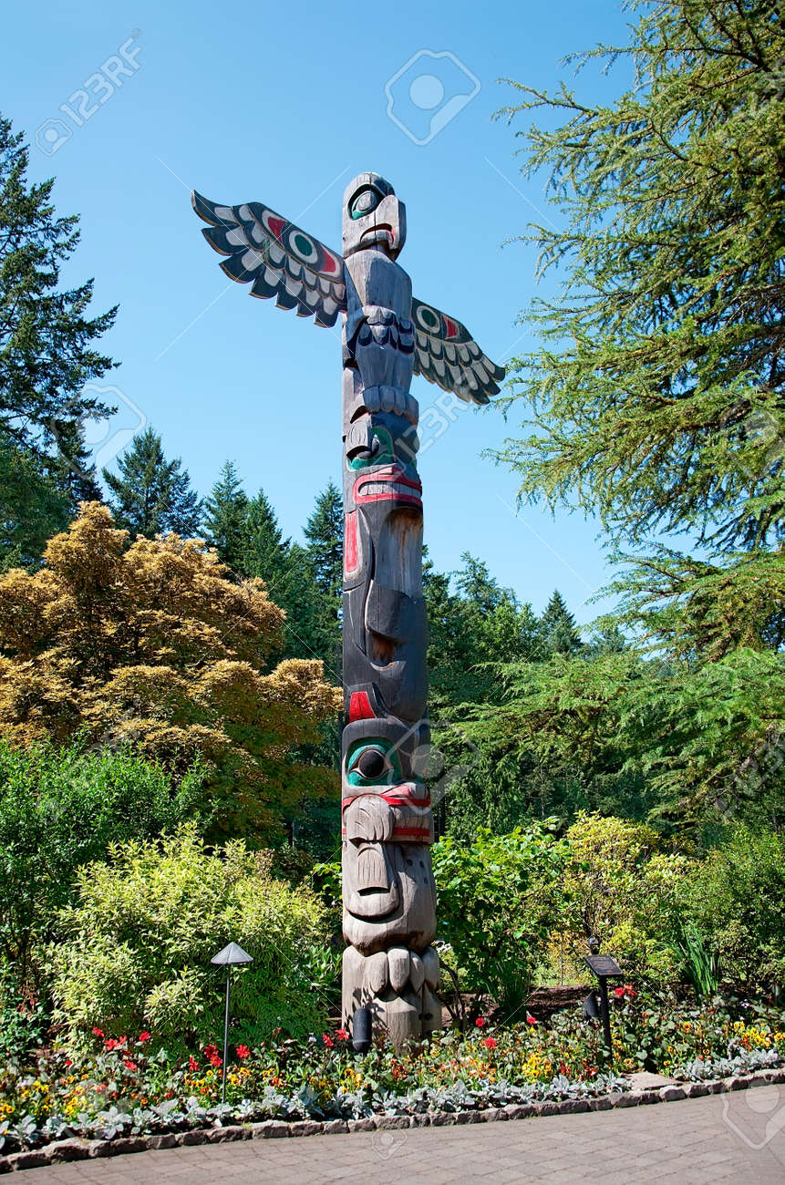 22144658-aboriginal-totem-pole-stands-in-the-butchart-gardens-central-saanich-bc-canada.jpg