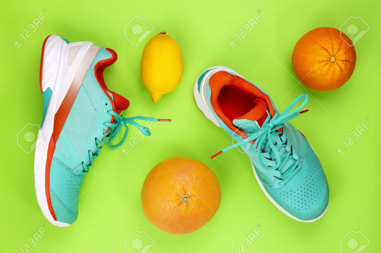 orange and green tennis shoes
