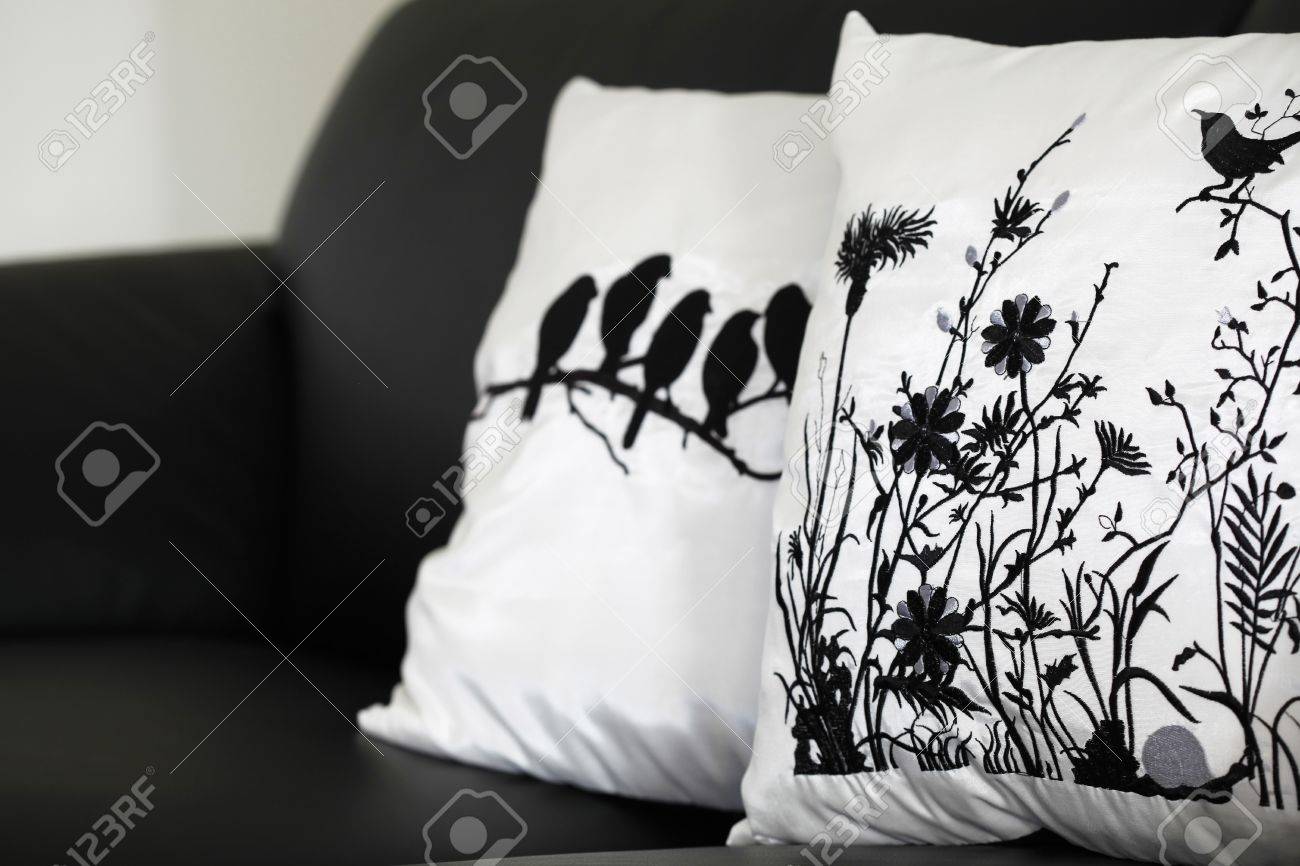 Black And White Collection Of Pillow Cases On Black Leather Couch. Generic Designs So No Black And White Collection Of Pillow Cases On Black Leather Couch. Generic Designs So No