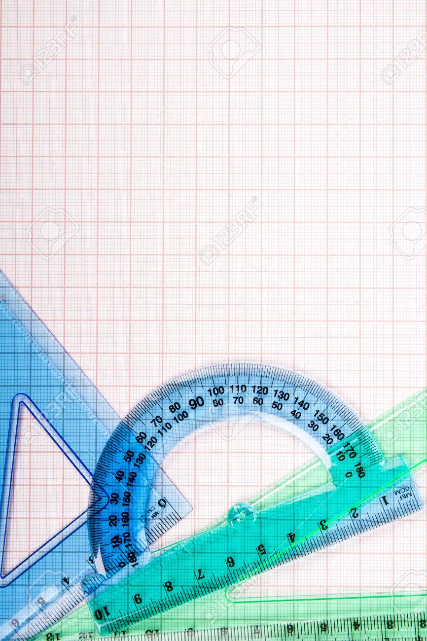 drawing tools on blue graph paper with copy space stock photo