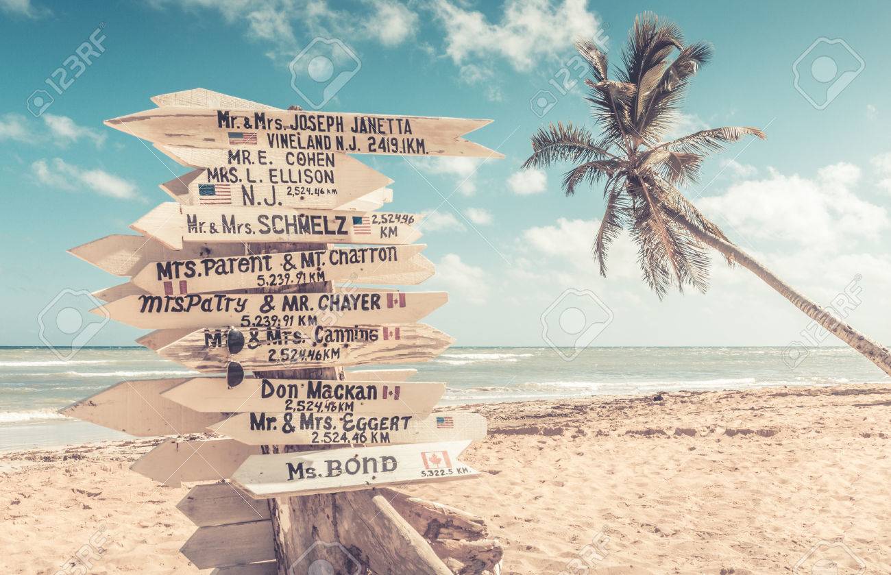 funny direction signpost with names of newlyweds stock photo