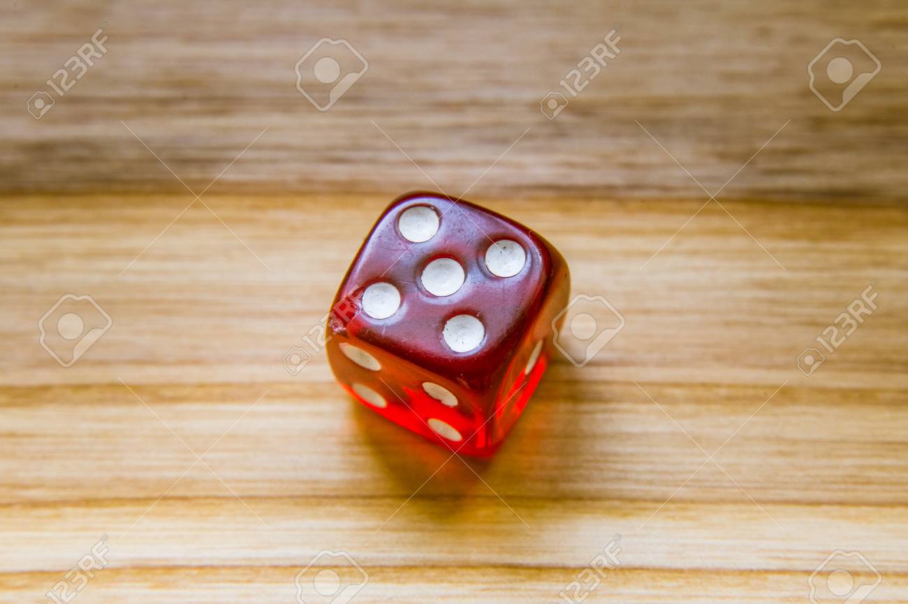 A Beautiful Winning Playing Dice Rolled On A Side On Wooden Table Stock Photo Picture And Royalty Free Image Image 80678863