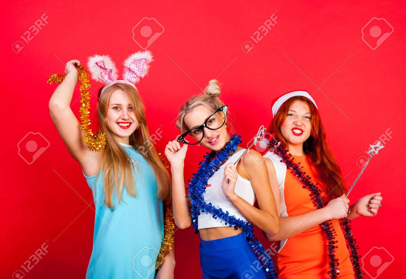 Young nice girls have fun on a party - 49276090 Young nice girls have fun on a party - 49276090