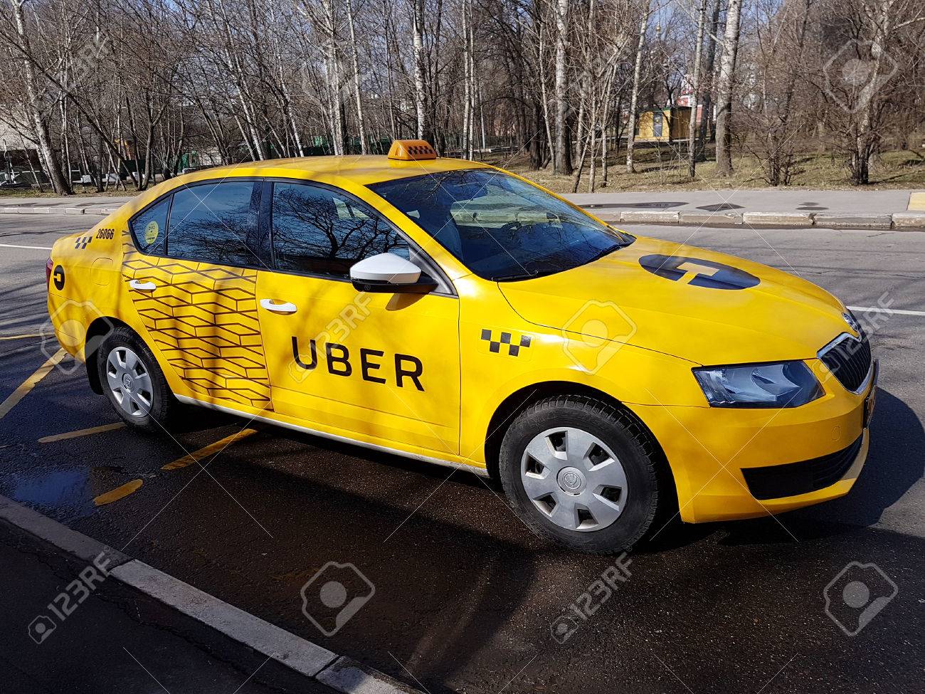 Moscow, Russia - April 11, 2017: New Yellow Taxi With Uber Logo