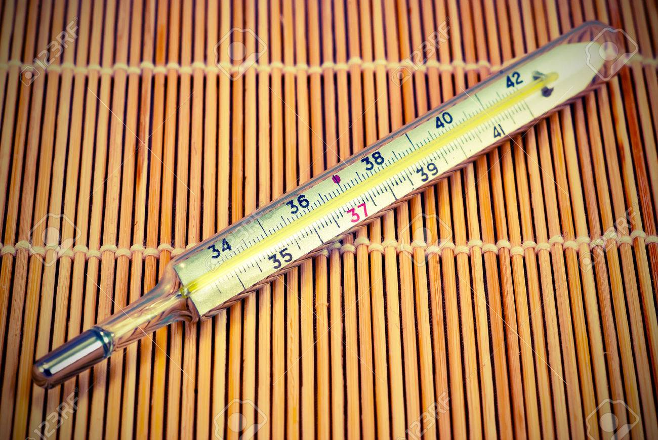 Mercury Thermometer In A Wooden Rug Background Vintage Style Stock Photo Picture And Royalty Free Image Image 28045177